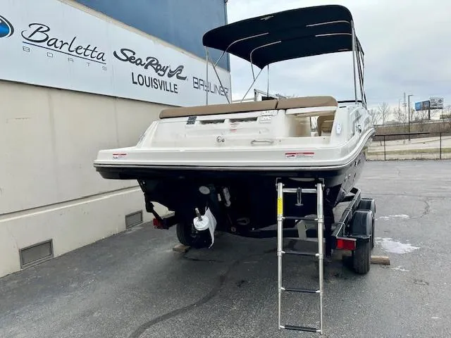 Slide: The Image of 2025 Bayliner VR6 Bowrider I/O boat on trailer, parked at dealership. - 3