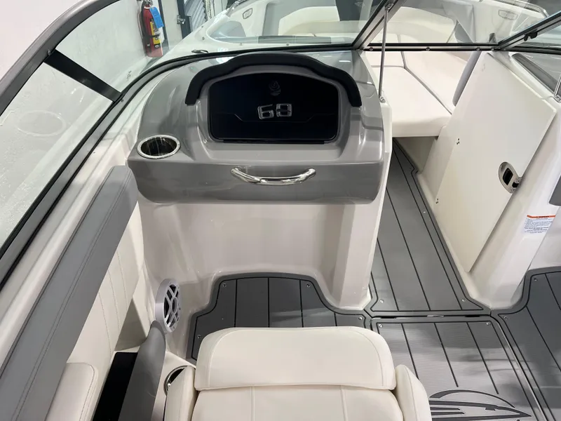 Slide: The Image of 2025 Chaparral 21 SSi boat interior with modern dashboard and seating. - 13