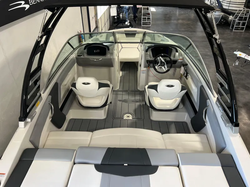 Slide: The Image of 2025 Chaparral 21 SSi boat interior with modern seating and steering wheel. - 3
