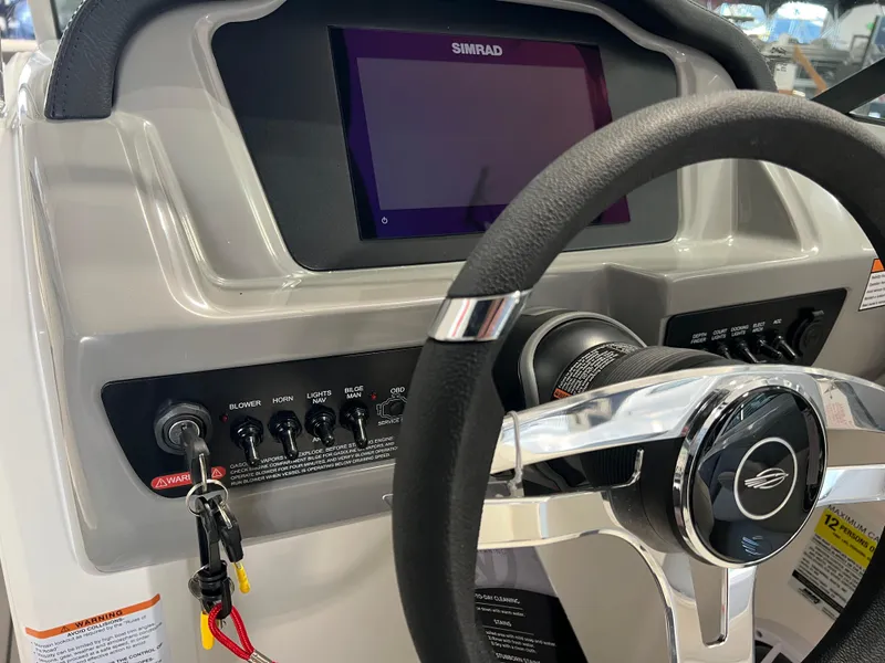 Slide: The Image of Dashboard of 2025 Chaparral 21 SSi boat with steering wheel and control panel. - 6