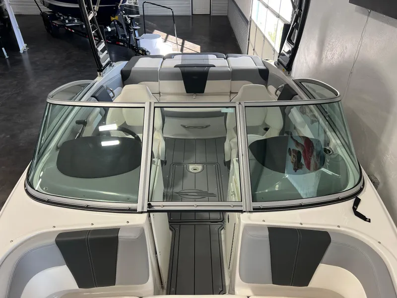 Slide: The Image of 2025 Chaparral 21 SSi boat interior with sleek seating and modern design. - 9