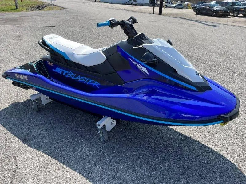 Slide: The Image of 2024 Yamaha Waverunner Jet Blaster in vibrant blue on pavement. - 11