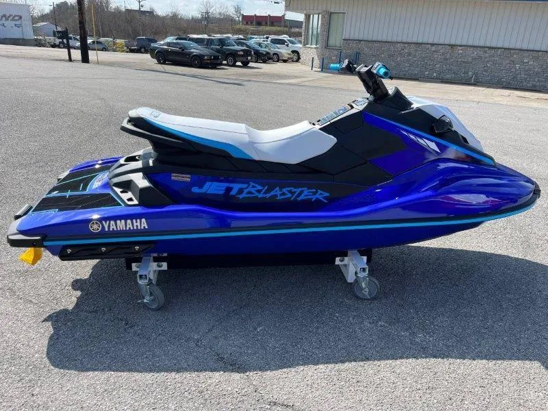 Slide: The Image of 2024 Yamaha Waverunner Jet Blaster in vibrant blue on display outdoors. - 12