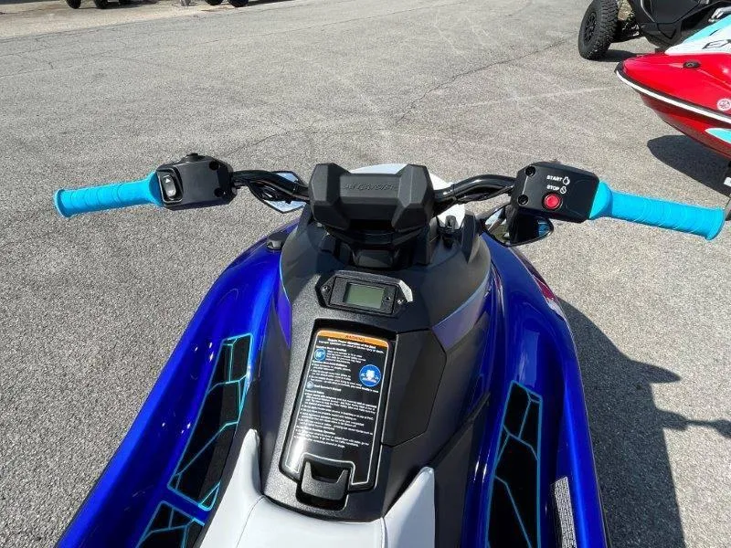Slide: The Image of 2024 Yamaha Waverunner Jet Blaster with blue handlebars and digital display. - 13
