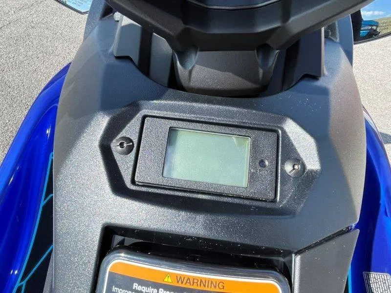 Slide: The Image of 2024 Yamaha Waverunner Jet Blaster dashboard with digital display and warning label. - 14