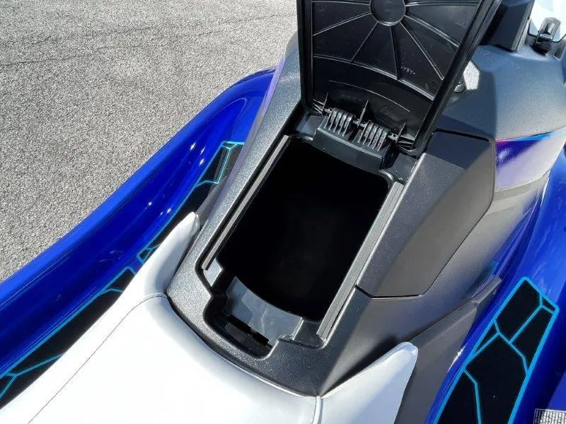 Slide: The Image of 2024 Yamaha Waverunner Jet Blaster storage compartment open, showcasing sleek design and vibrant colors. - 20