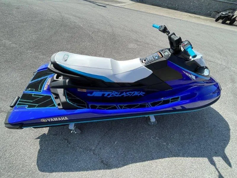 Slide: The Image of 2024 Yamaha Waverunner Jet Blaster in vibrant blue on pavement. - 24