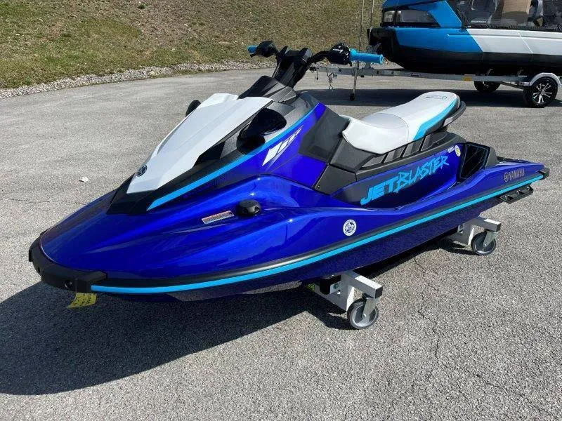 Slide: The Image of 2024 Yamaha Waverunner Jet Blaster in vibrant blue on display outdoors. - 3