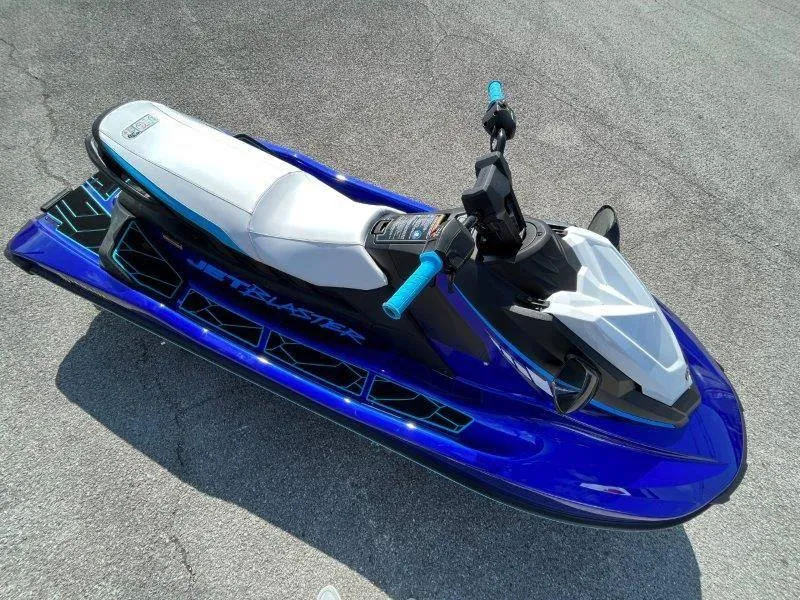 Slide: The Image of 2024 Yamaha Waverunner Jet Blaster in blue, parked on pavement. - 34