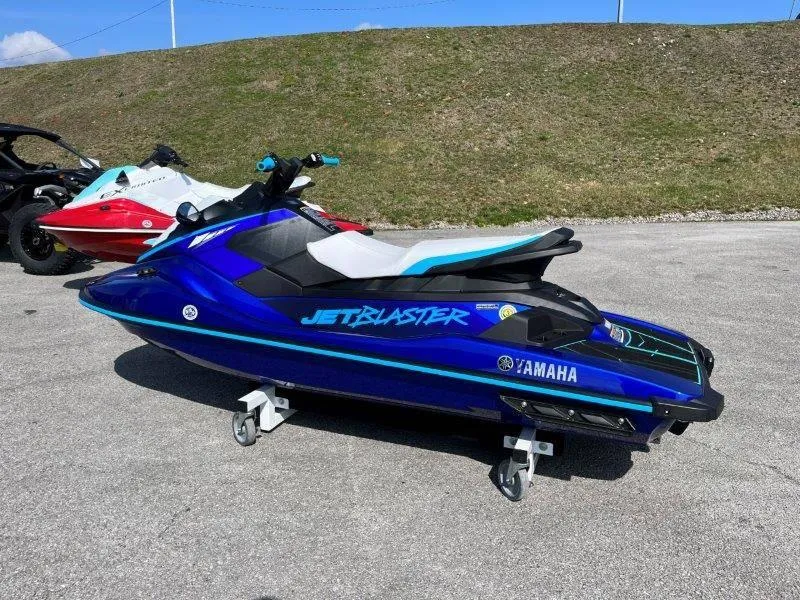 Slide: The Image of 2024 Yamaha Waverunner Jet Blaster in blue, parked on pavement. - 5