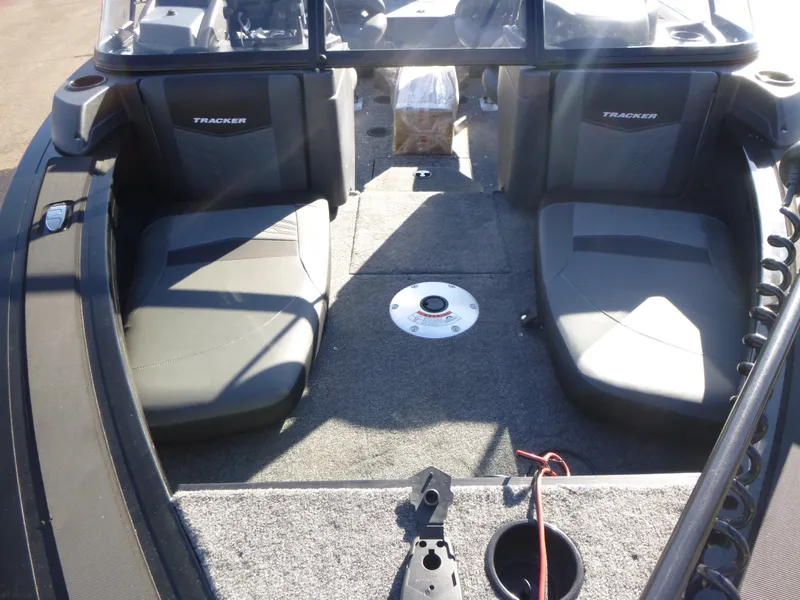 Slide: The Image of 2025 Tracker Targa V-18 Combo boat interior with seating and carpeted deck. - 13