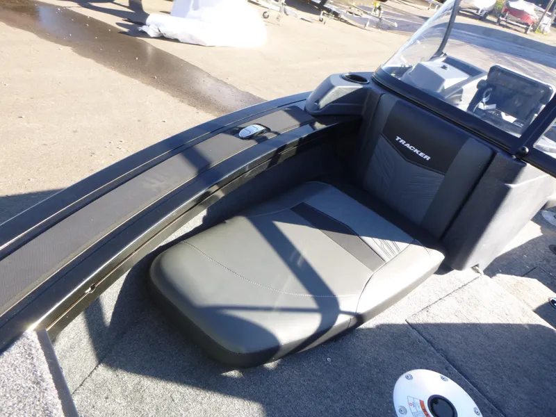 Slide: The Image of 2025 Tracker Targa V-18 Combo boat interior with seating and dashboard. - 14