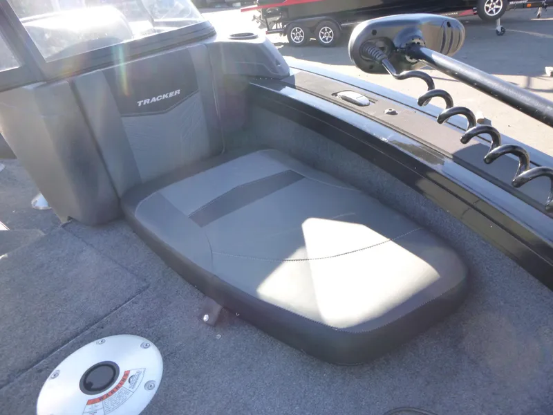 Slide: The Image of 2025 Tracker Targa V-18 Combo boat interior with seating and trolling motor. - 15