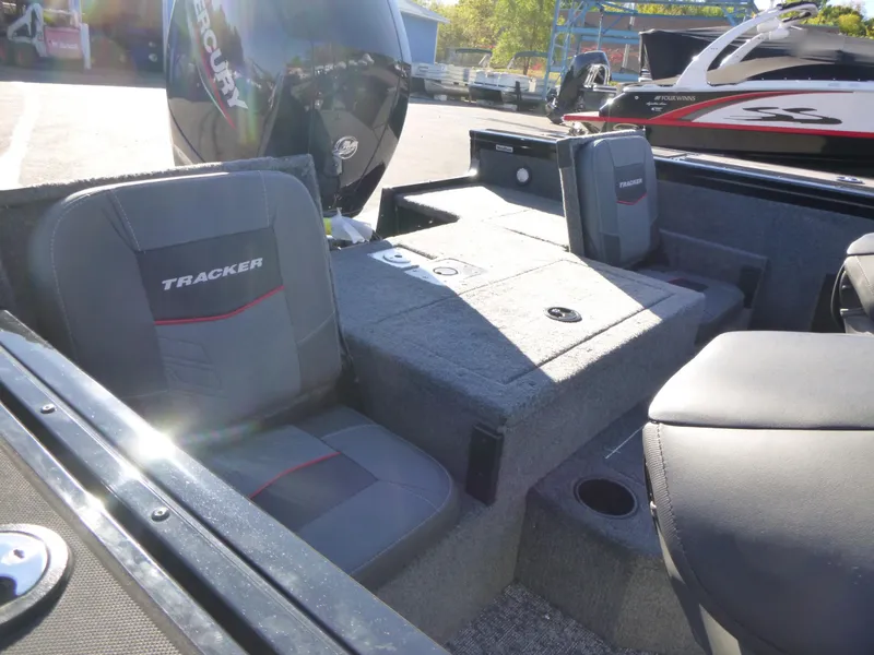Slide: The Image of 2025 Tracker Targa V-18 Combo boat interior with seating and storage compartments. - 22