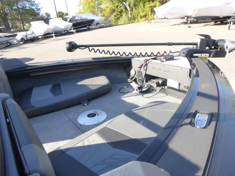 Slide: The Image of 2025 Tracker Targa V-18 Combo boat interior with trolling motor and seating. - 28