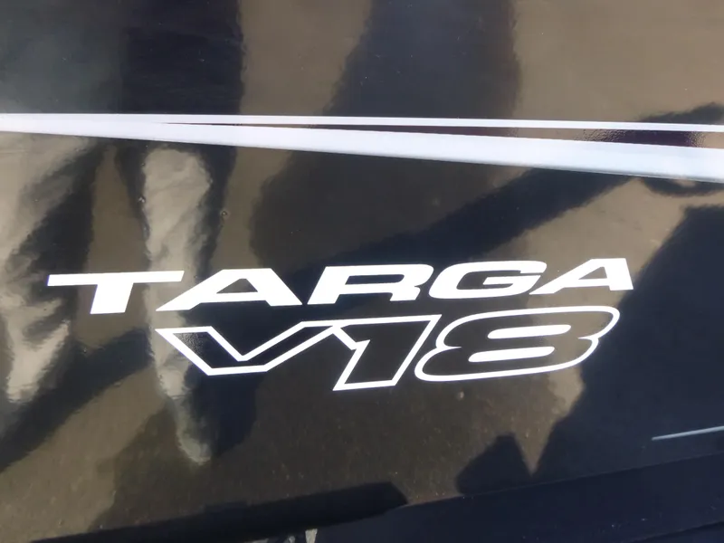 Slide: The Image of 2025 Tracker Targa V-18 Combo logo on black surface. - 29