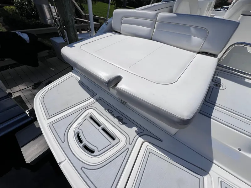 Slide: The Image of 2012 Sea Ray 280 Sundeck boat with white seating and deck details. - 18