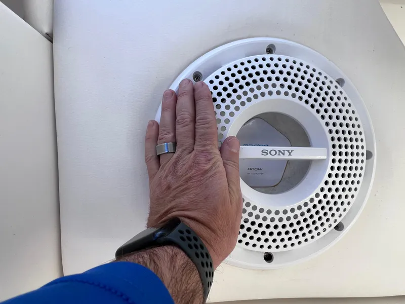 Slide: The Image of Hand touching Sony speaker on 2012 Sea Ray 280 Sundeck boat. - 25