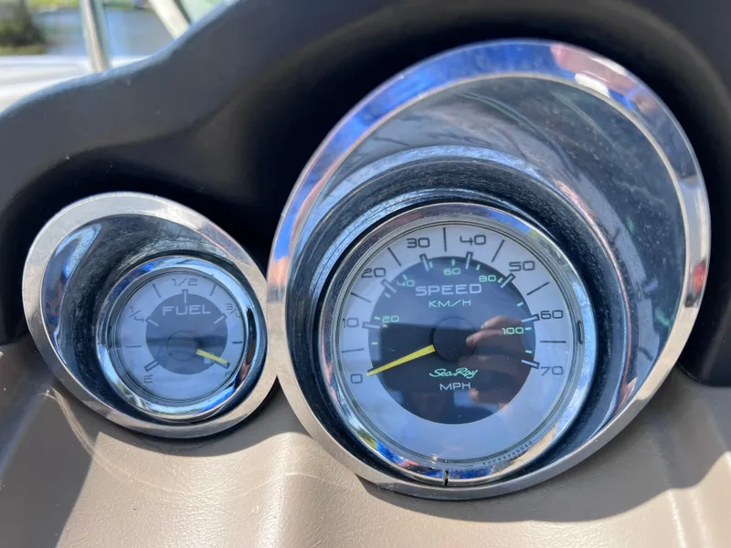 Slide: The Image of Dashboard gauges of 2012 Sea Ray 280 Sundeck boat, showing speedometer and fuel level. - 36