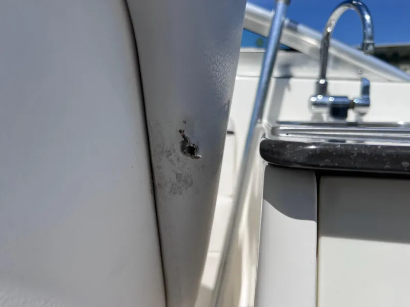 Slide: The Image of 2012 Sea Ray 280 Sundeck interior with minor damage near sink area. - 42