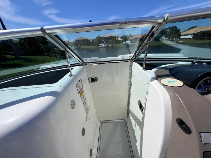 Slide: The Image of 2012 Sea Ray 280 Sundeck interior with windshield, showcasing sleek design and spacious layout. - 48