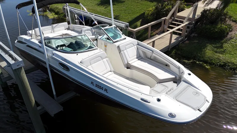 Slide: The Image of 2012 Sea Ray 280 Sundeck boat docked by wooden pier. - 5
