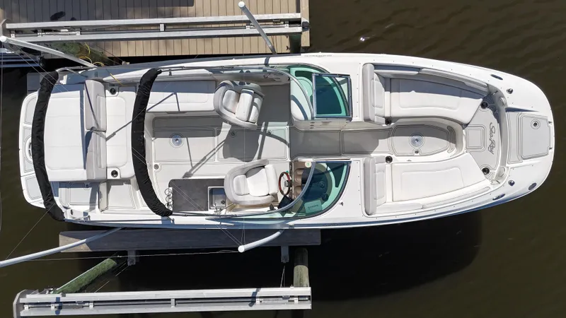 Slide: The Image of 2012 Sea Ray 280 Sundeck boat docked, aerial view showing spacious seating and sleek design. - 6