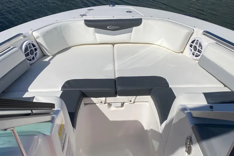 Slide: The Image of 2023 Robalo R207 Dual Console boat interior with cushioned seating. - 3