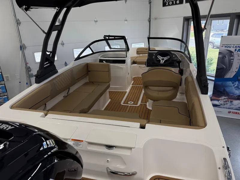 Slide: The Image of 2025 Bayliner VR4 Bowrider OB interior with tan seating and modern design. - 4