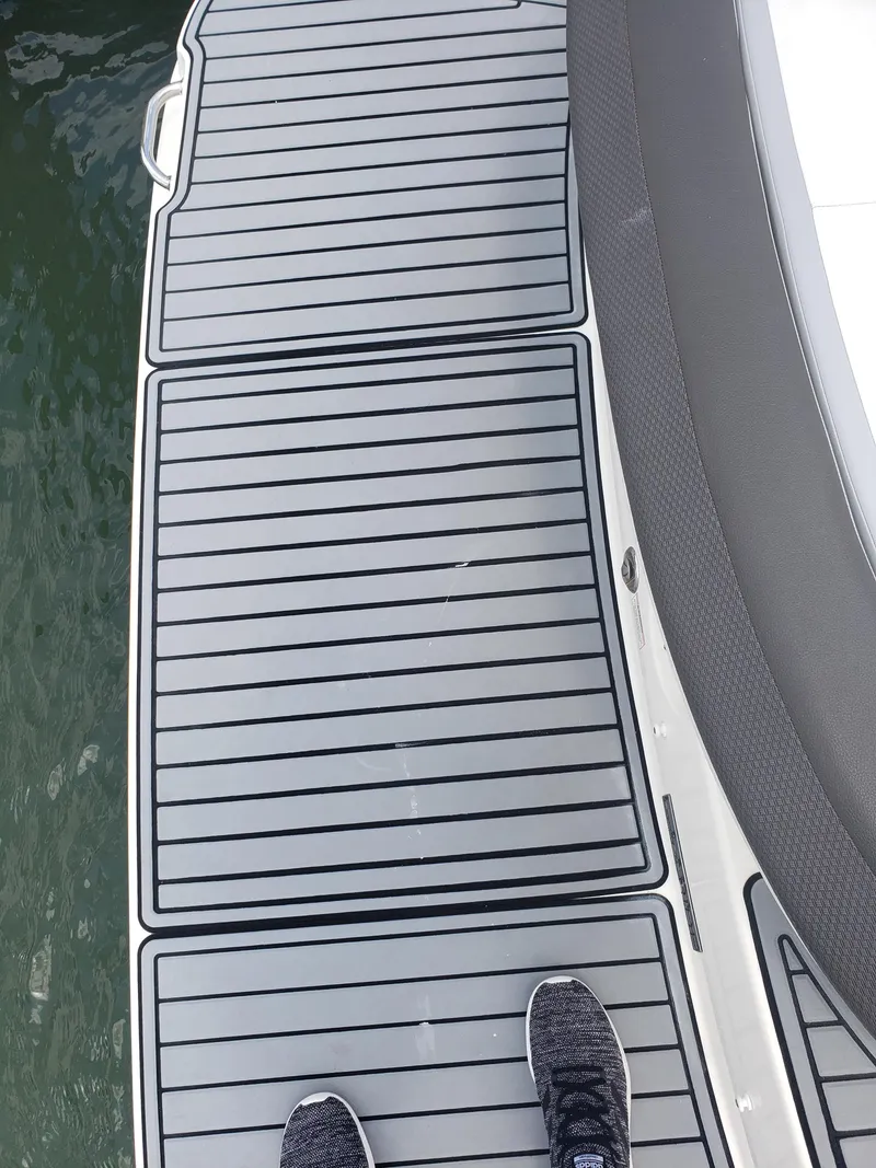 Slide: The Image of 2016 Sea Ray 280 SLX boat deck with gray non-slip surface. - 28