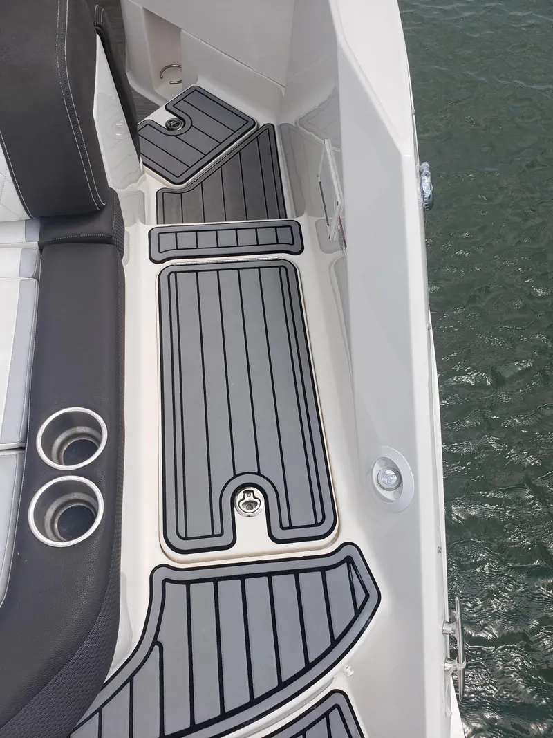 Slide: The Image of 2016 Sea Ray 280 SLX boat deck with sleek black and gray flooring. - 29