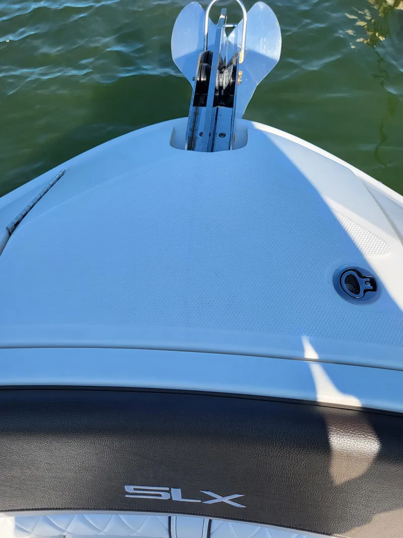 Slide: The Image of 2016 Sea Ray 280 SLX boat bow with anchor, on calm water. - 31