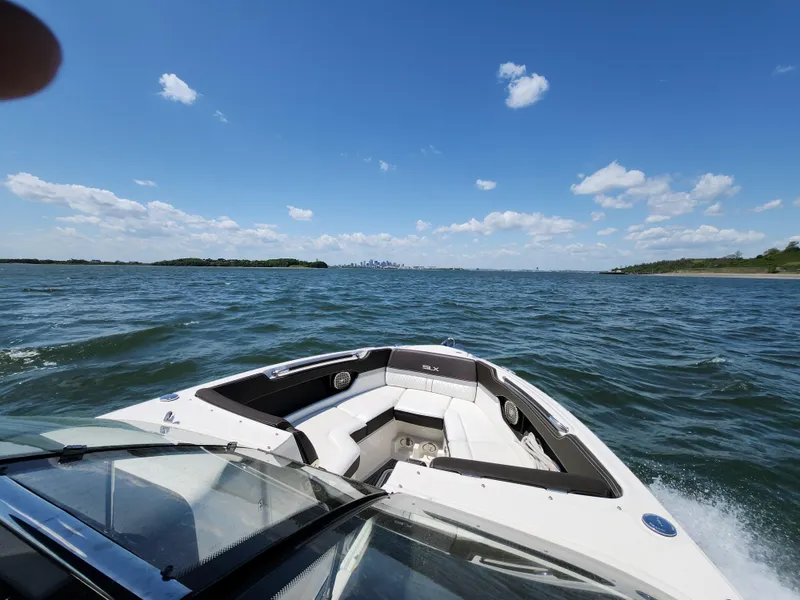 Slide: The Image of Sea Ray 280 SLX 2016 cruising on open water under a clear blue sky. - 32