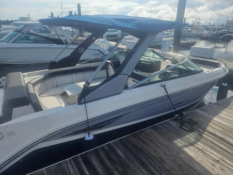 Slide: The Image of 2016 Sea Ray 280 SLX boat docked at marina, featuring sleek design and spacious seating. - 41