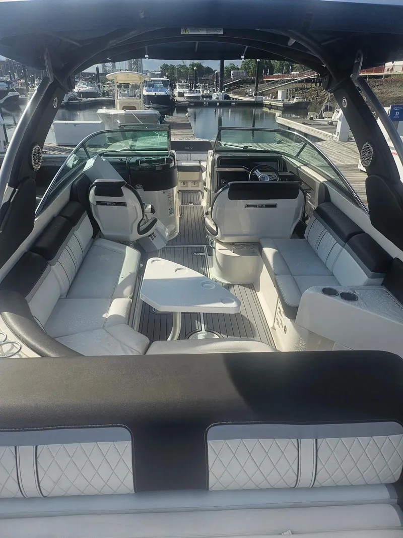Slide: The Image of Interior of a 2016 Sea Ray 280 SLX boat with luxurious seating and table. - 43