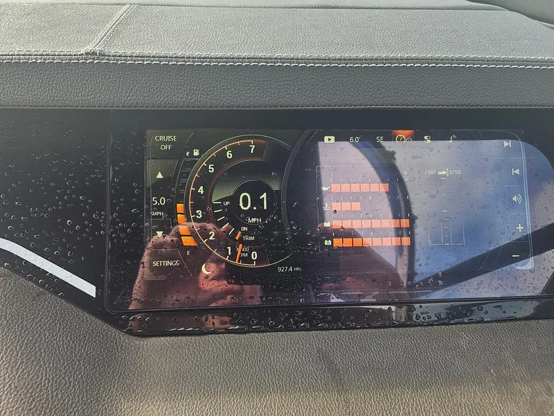 Slide: The Image of Dashboard of a 2016 Sea Ray 280 SLX boat with digital display and raindrops. - 46