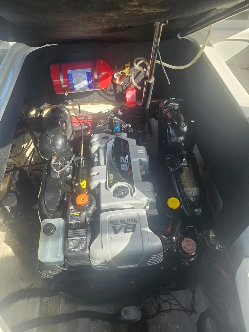 Slide: The Image of Engine compartment of a 2016 Sea Ray 280 SLX with a V8 engine and fire extinguisher. - 48