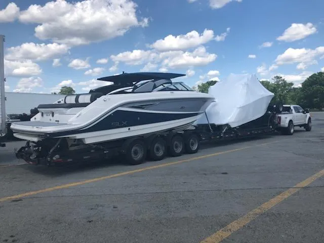 Slide: The Image of 2016 Sea Ray 280 SLX boat on trailer under blue sky. - 5
