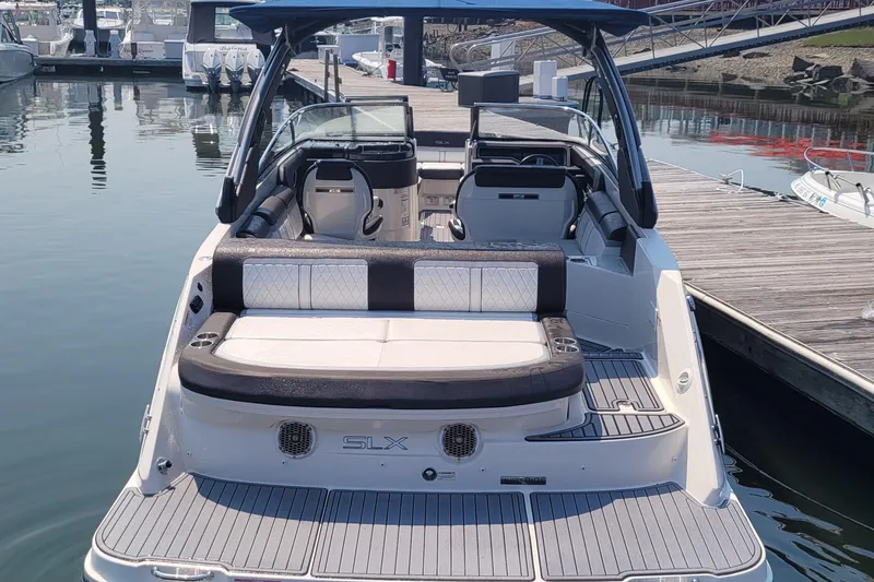 Slide: The Image of 2016 Sea Ray 280 SLX boat docked at marina, rear view. - 9
