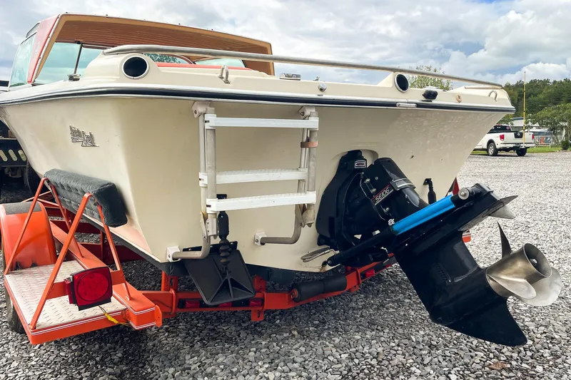 Slide: The Image of 1975 AristoCraft 19 boat on trailer, rear view with outboard motor. - 13