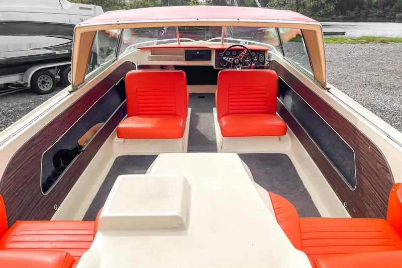 Slide: The Image of 1975 AristoCraft 19 boat interior with red seats and vintage dashboard. - 16