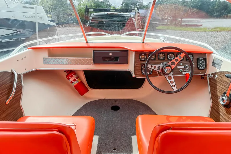 Slide: The Image of 1975 AristoCraft 19 boat interior with orange seats and vintage dashboard. - 20