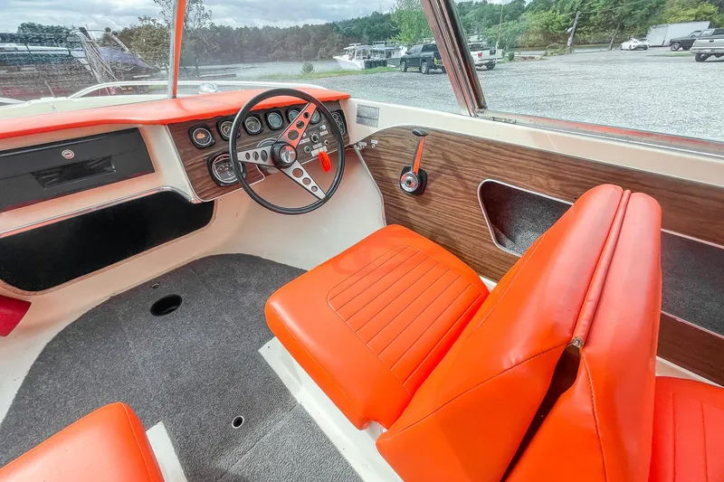 Slide: The Image of Vintage 1975 AristoCraft 19 boat interior with orange seats and classic dashboard. - 21