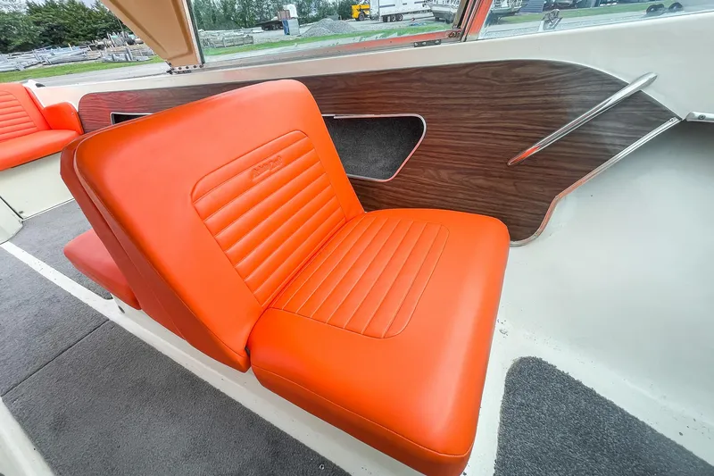 Slide: The Image of Vintage 1975 AristoCraft 19 boat interior with orange seats and wood paneling. - 23