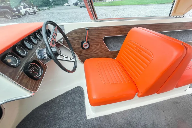 Slide: The Image of Vintage 1975 AristoCraft 19 boat interior with orange seats and wood panel dashboard. - 24