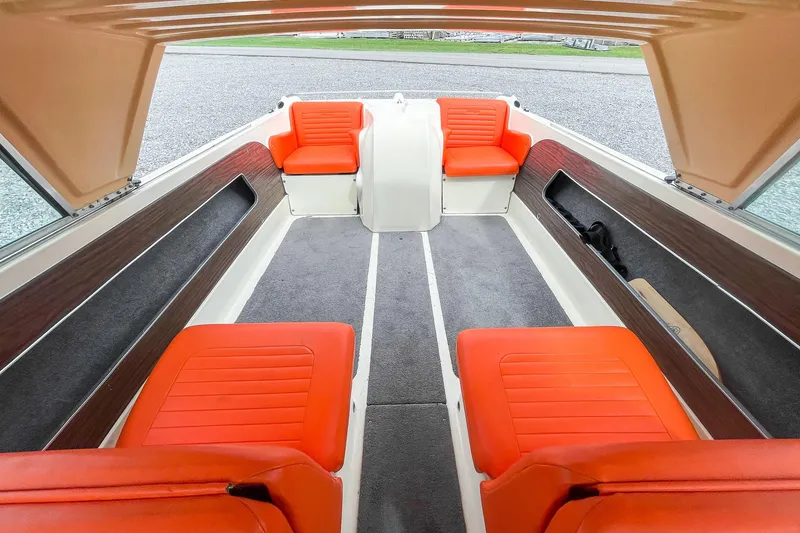 Slide: The Image of 1975 AristoCraft 19 boat interior with vibrant orange seating and spacious layout. - 25