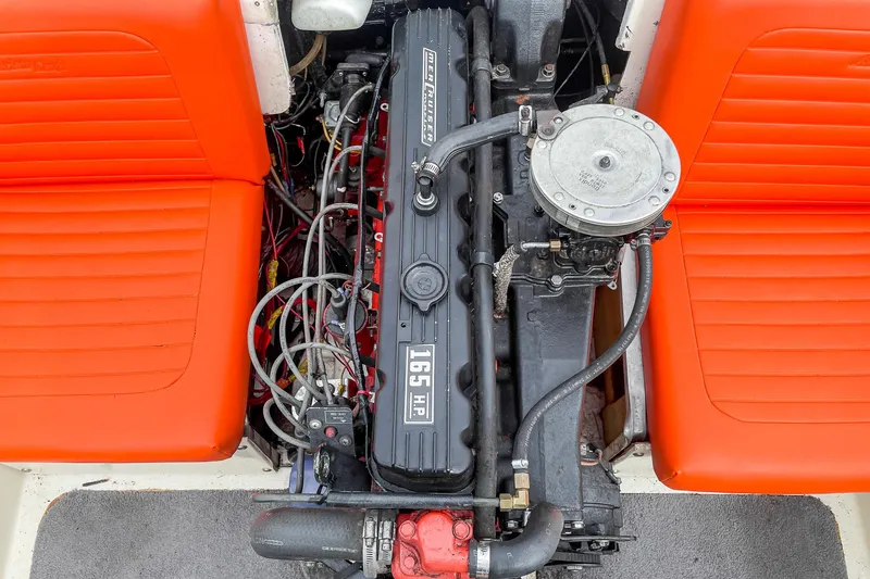 Slide: The Image of 1975 AristoCraft 19 engine with vibrant orange seats, showcasing classic boat design. - 27