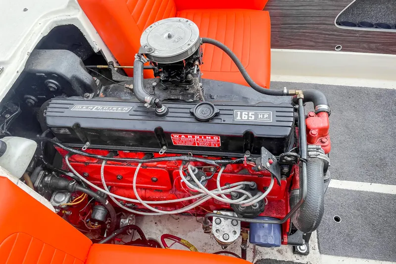 Slide: The Image of 1975 AristoCraft 19 boat engine, 165 HP, with vibrant red and black components. - 28