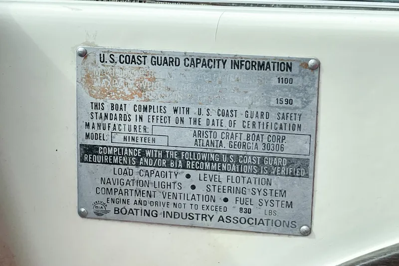 Slide: The Image of 1975 AristoCraft 19 boat capacity plate with U.S. Coast Guard compliance details. - 32