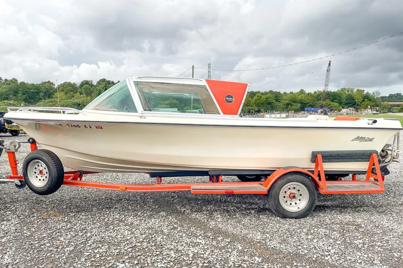 Slide: The Image of 1975 AristoCraft 19 boat on trailer, parked outdoors on gravel. - 6
